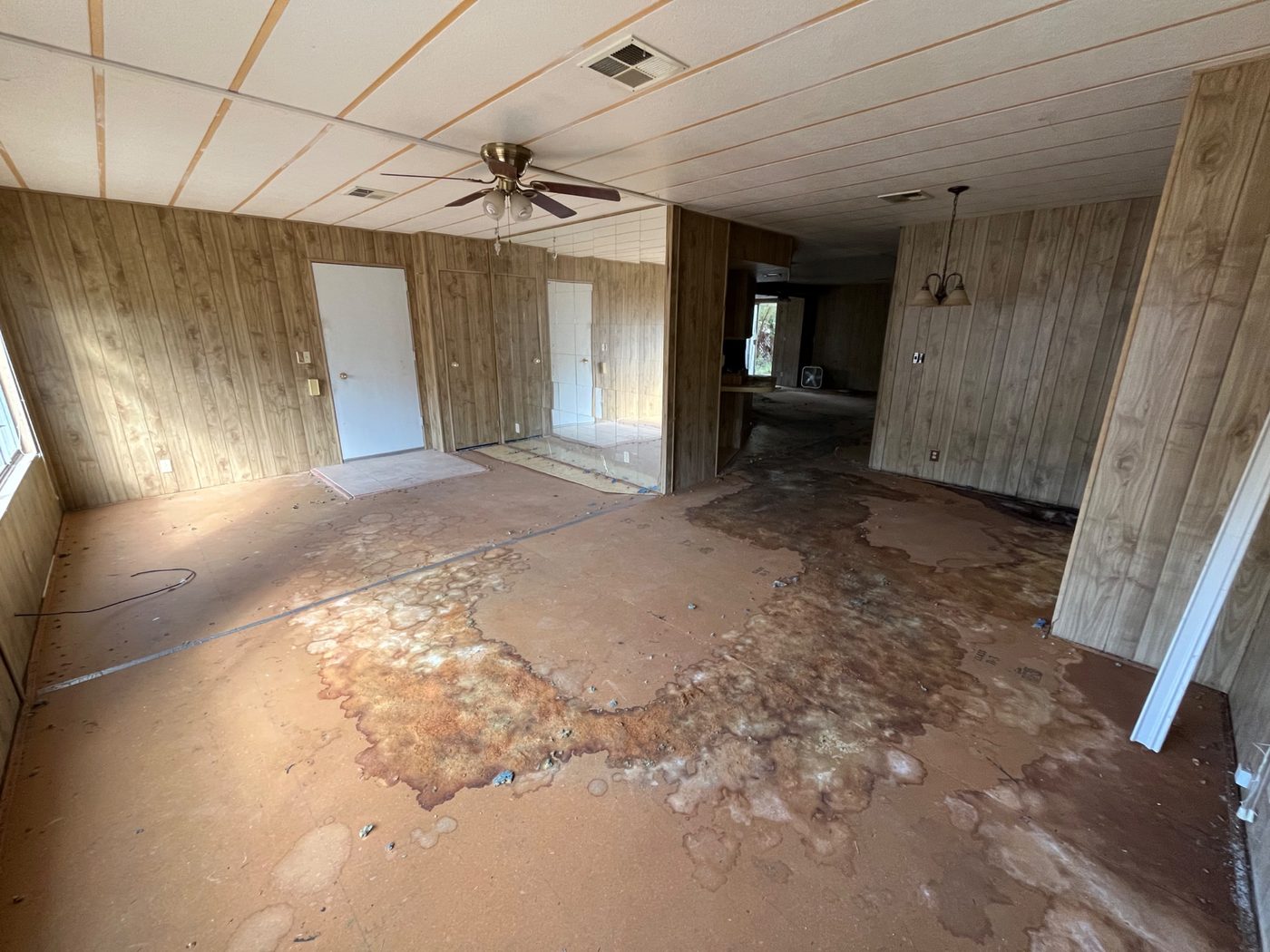 Mobile home interior with fire and water damage, purchased as-is by Infinite Legacy Property Solutions