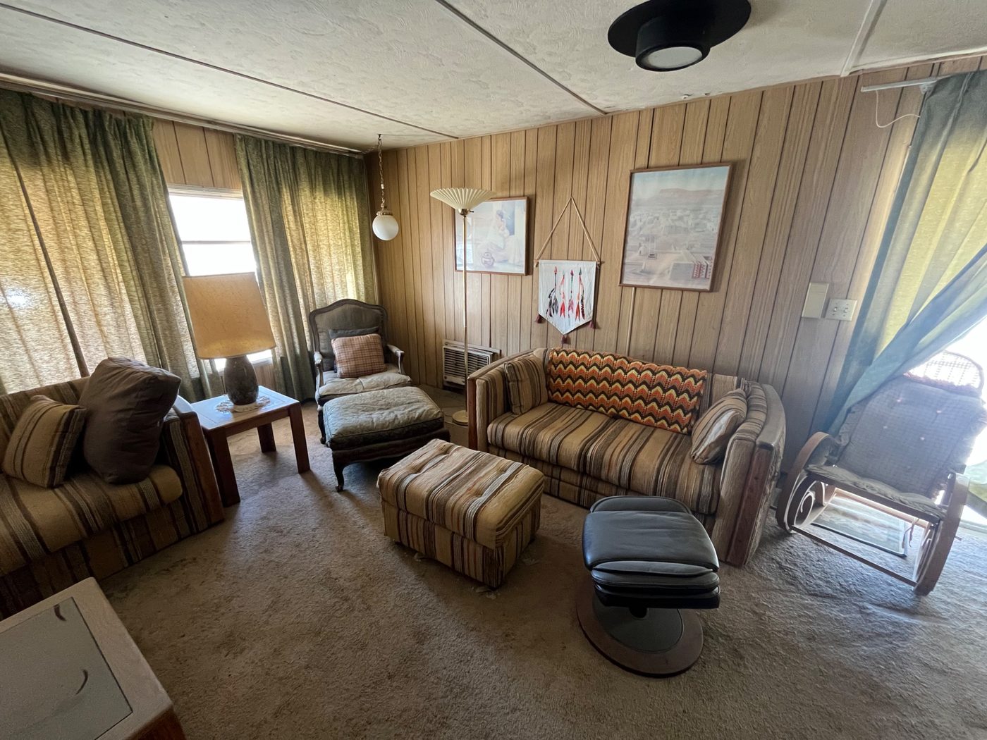 Dated 1970s-era living room with original furniture, purchased as-is by Infinite Legacy Property Solutions